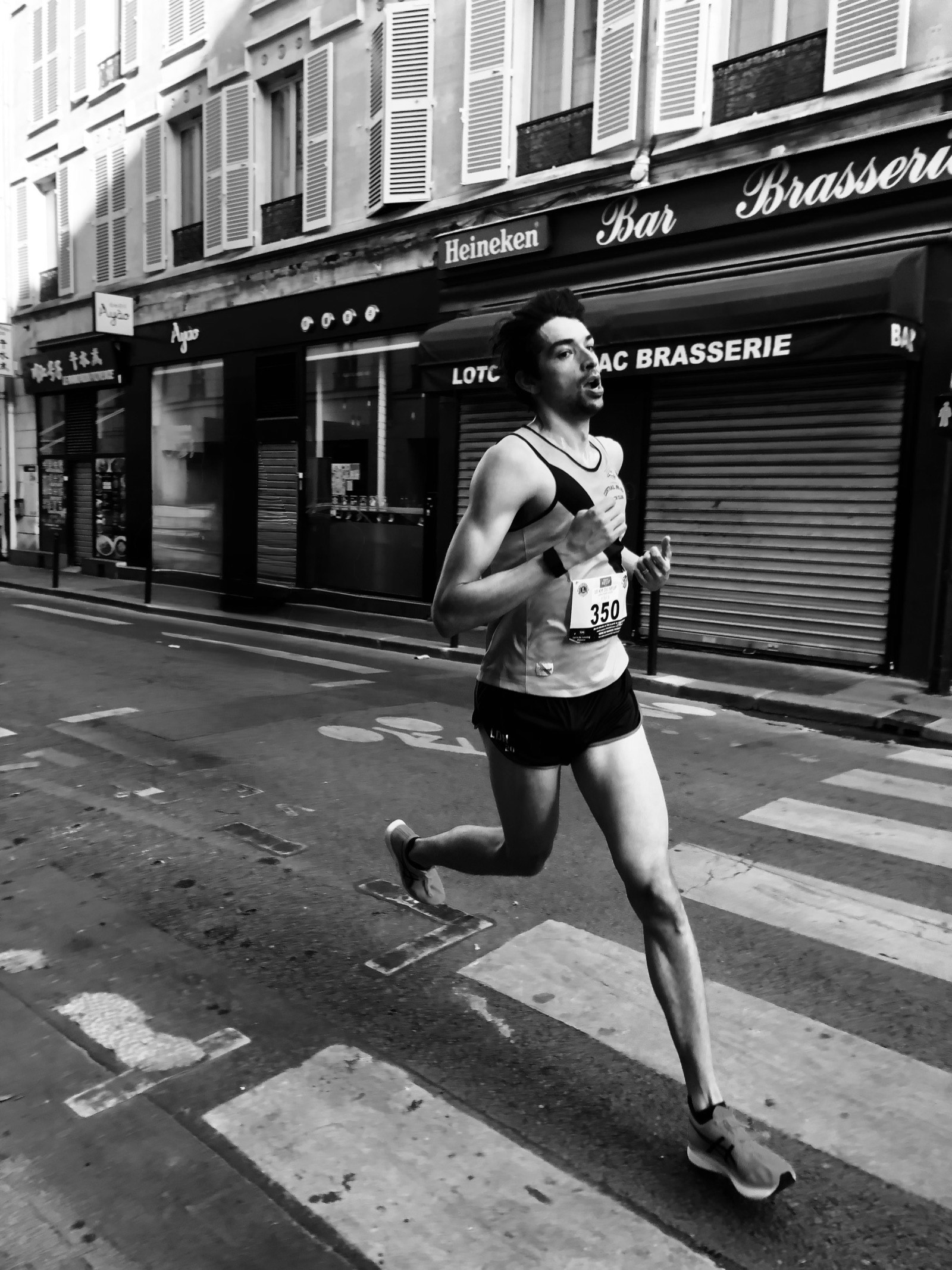 Runner racing through city streets